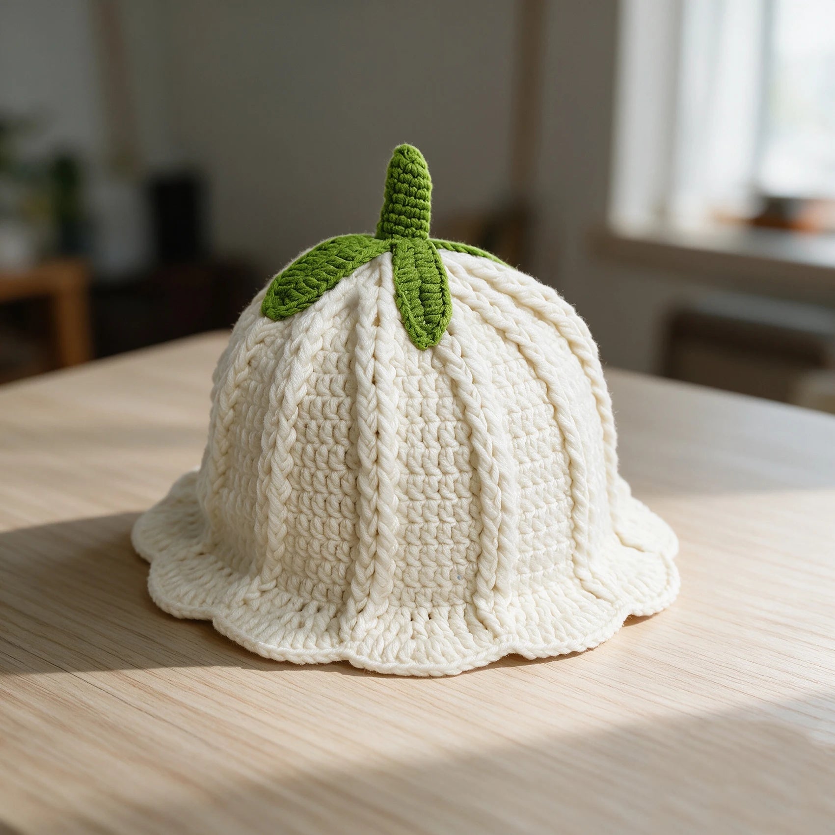 Knotwild hand-crocheted persimmon-colored ruffled bucket hat